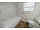 Clean bathroom with new tub and flooring at 1471 Midview Dr, Decatur, GA 30032