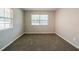 Well-lit bedroom with neutral walls and carpet at 1471 Midview Dr, Decatur, GA 30032