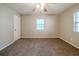 Bright bedroom with ceiling fan, neutral walls, and brown carpet at 1471 Midview Dr, Decatur, GA 30032
