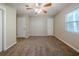 Well-lit bedroom with ceiling fan and neutral wall colors at 1471 Midview Dr, Decatur, GA 30032