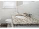 Bathroom with granite countertop, white cabinets, and updated fixtures at 3686 Thurman Rd, Atlanta, GA 30349