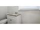 Small bathroom with granite countertop and white vanity at 3686 Thurman Rd, Atlanta, GA 30349