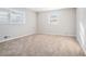 Bright bedroom with neutral carpet and large windows at 3686 Thurman Rd, Atlanta, GA 30349