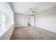 Bright bedroom with window and ceiling fan at 3686 Thurman Rd, Atlanta, GA 30349