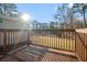 Wooden deck overlooking a grassy backyard with mature trees at 3686 Thurman Rd, Atlanta, GA 30349