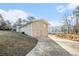Two-car garage with a long driveway at 3686 Thurman Rd, Atlanta, GA 30349