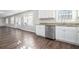 Kitchen with white cabinets, granite counters, and stainless steel appliances at 3686 Thurman Rd, Atlanta, GA 30349