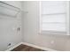 Laundry room with wire shelving and vinyl flooring at 3686 Thurman Rd, Atlanta, GA 30349