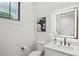 Modern bathroom with white vanity, quartz countertop and LED mirror at 414 Langford Dr, Norcross, GA 30071