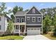 Two-story gray house with white trim, and a two car garage at 414 Langford Dr, Norcross, GA 30071