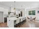 Modern kitchen with white cabinets, marble countertops, and gold accents at 414 Langford Dr, Norcross, GA 30071