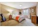 Bright bedroom with carpeted floors and neutral walls at 601 Trombley Bay Ln, Lawrenceville, GA 30044