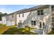 Row of townhouses with private fenced backyards and patios at 1080 Cades Walk, Lawrenceville, GA 30045