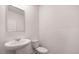 Clean and simple half bathroom with pedestal sink at 1080 Cades Walk, Lawrenceville, GA 30045
