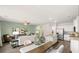 Open concept kitchen and dining area with hardwood floors and view of living room at 1080 Cades Walk, Lawrenceville, GA 30045