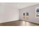 Bright dining room with hardwood floors and French doors leading to the backyard at 1080 Cades Walk, Lawrenceville, GA 30045