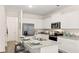 Modern kitchen with white cabinets, granite countertops, and island at 1080 Cades Walk, Lawrenceville, GA 30045