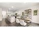 Modern kitchen featuring a large island, stainless steel appliances, and granite countertops at 1080 Cades Walk, Lawrenceville, GA 30045