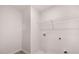 Bright laundry room with ample shelving at 1080 Cades Walk, Lawrenceville, GA 30045