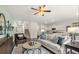 Spacious living room with hardwood floors, a ceiling fan, and access to the kitchen at 1080 Cades Walk, Lawrenceville, GA 30045