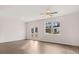 Bright living room featuring hardwood floors and French doors at 1080 Cades Walk, Lawrenceville, GA 30045