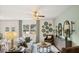 Living room with neutral decor, large windows, and hardwood floors at 1080 Cades Walk, Lawrenceville, GA 30045
