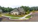 Community pool with clubhouse and surrounding landscaping at 1100 Cades Walk, Lawrenceville, GA 30045