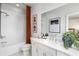 Clean bathroom with white subway tiles, bathtub, and a modern vanity at 2425 Red Maple Xing # 125, Smyrna, GA 30080