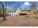 Deck and backyard with firepit and surrounding trees at 2934 Seagull Dr, Duluth, GA 30096