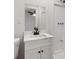 Updated bathroom with white vanity, quartz countertop and a walk-in shower at 308 Pine Cir, Bowdon, GA 30108