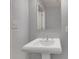 Clean bathroom with pedestal sink and mirror at 57 Forsyth Nw St # 4D, Atlanta, GA 30303
