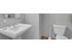Simple bathroom with pedestal sink and toilet at 57 Forsyth Nw St # 4D, Atlanta, GA 30303
