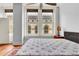 Bedroom with city views, hardwood floors, and large windows at 57 Forsyth Nw St # 4D, Atlanta, GA 30303
