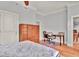 Bedroom with hardwood floors, built-in shelving and home office at 57 Forsyth Nw St # 4D, Atlanta, GA 30303