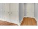 Bright hallway with hardwood floors and neutral walls at 57 Forsyth Nw St # 4D, Atlanta, GA 30303