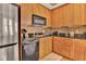 Modern kitchen with stainless steel appliances and wood cabinets at 57 Forsyth Nw St # 4D, Atlanta, GA 30303