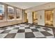 Elegant building lobby with marble floors and brass elevators at 57 Forsyth Nw St # 4D, Atlanta, GA 30303