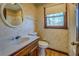 Clean bathroom with a vanity, toilet, and shower/tub at 1060 River Cove Rd, Social Circle, GA 30025
