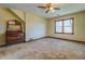 Spacious bedroom with large window and ceiling fan at 1060 River Cove Rd, Social Circle, GA 30025