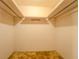 Walk-in closet with double hanging rods and shelving at 1060 River Cove Rd, Social Circle, GA 30025