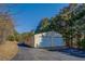 Double-car detached garage with white doors at 1060 River Cove Rd, Social Circle, GA 30025