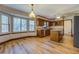 Open dining area with wood floors and kitchen views at 1060 River Cove Rd, Social Circle, GA 30025