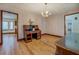 Bright dining room with hardwood floors and view to kitchen at 1060 River Cove Rd, Social Circle, GA 30025
