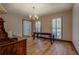 Dining room with hardwood floors and chandelier at 1060 River Cove Rd, Social Circle, GA 30025