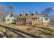 Ranch style home with large porch and landscaped yard at 1060 River Cove Rd, Social Circle, GA 30025