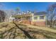 Yellow house with a large front yard and porch at 1060 River Cove Rd, Social Circle, GA 30025