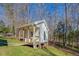 Small white guest house with porch and deck at 1060 River Cove Rd, Social Circle, GA 30025