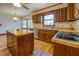 Spacious kitchen with wood cabinets, island, and stainless steel appliances at 1060 River Cove Rd, Social Circle, GA 30025