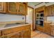 Kitchen boasts wood cabinets, updated appliances, and ample counter space at 1060 River Cove Rd, Social Circle, GA 30025