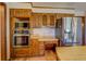 Modern kitchen with stainless steel appliances and wood cabinetry at 1060 River Cove Rd, Social Circle, GA 30025